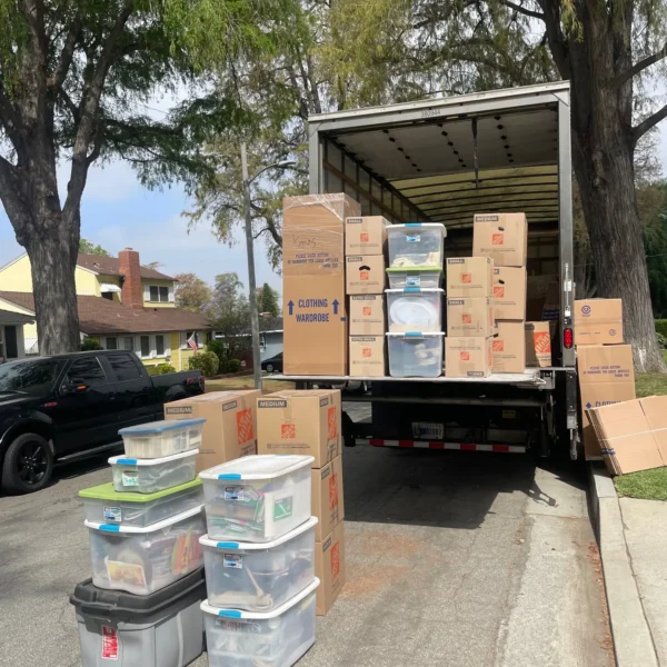 Titan Relocation Packing service in Los Angeles County, California—professional movers wrapping furniture and packing moving boxes safely