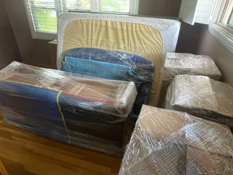 Professional moving team loading furniture into moving truck