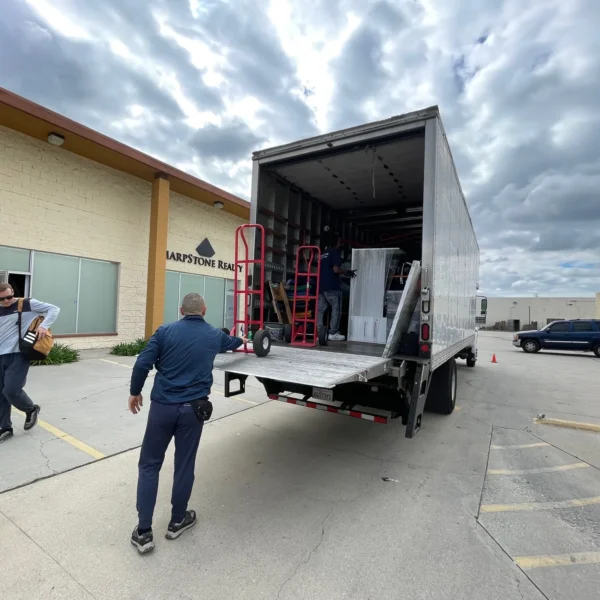 Titan Relocation office movers packing desks and office equipment for a Los Angeles County business relocation